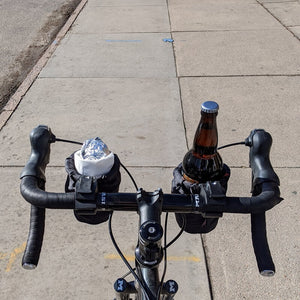 Road bike with two cup holders carrying a burrito and a beer