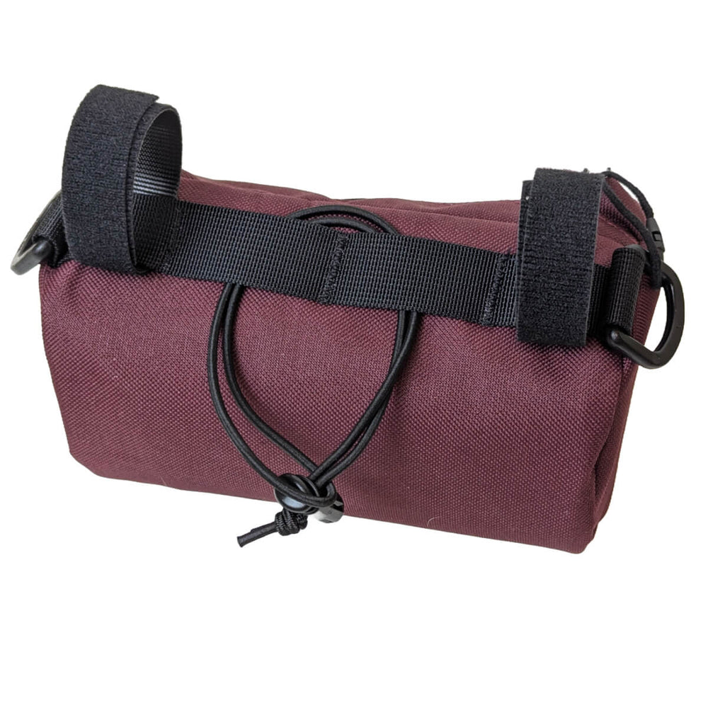 back view of maroon handlebar bag with bungee strap