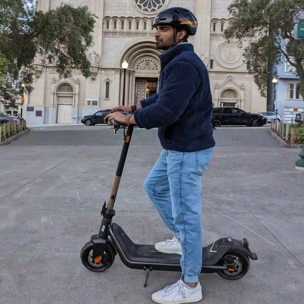 man on scooter wearing xnito helmet