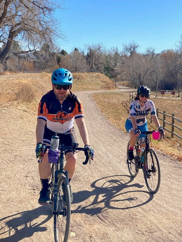 man and woman riding gravel bikes
