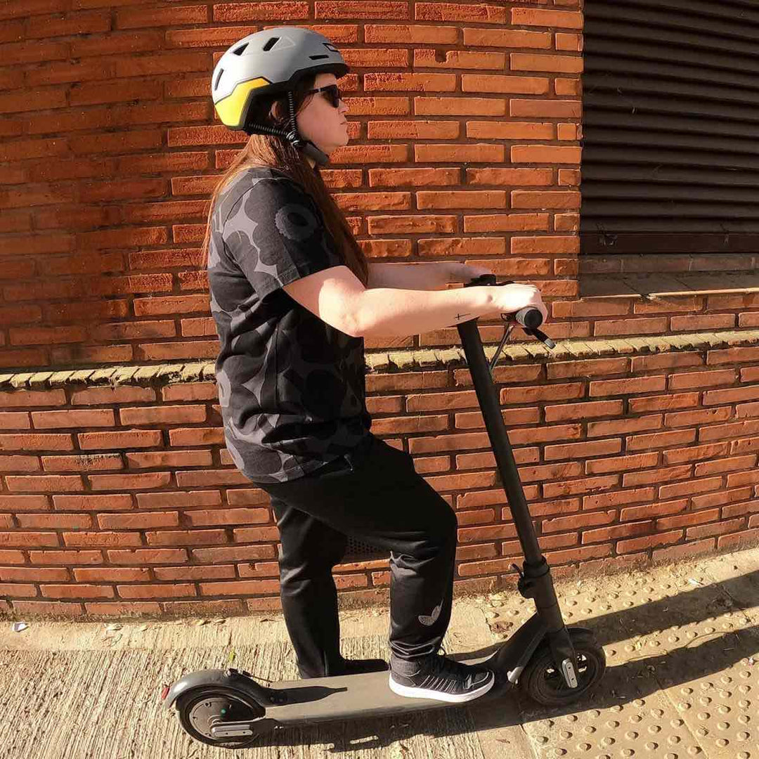 person on scooter wearing gull color xnito helmet
