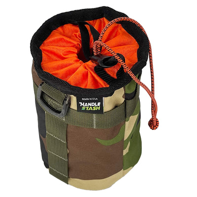 Camouflage bike stem bag with orange liner with top closed. 