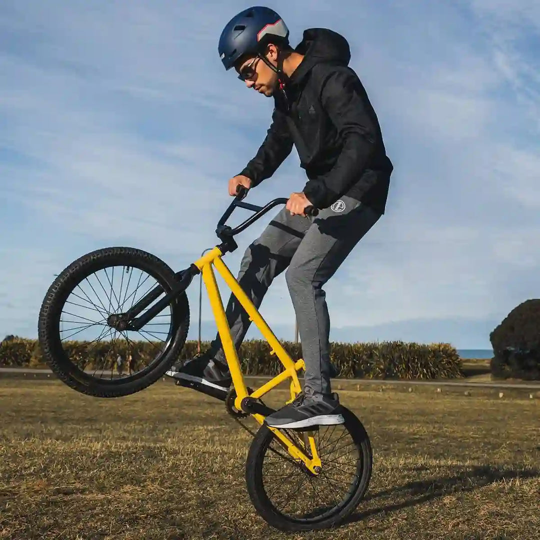 man doing a bunny hop wearing an xnito helmet