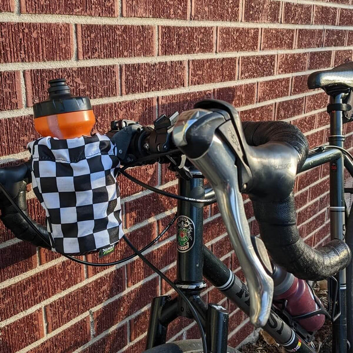 Checkered water bottle holder on drop bar bike