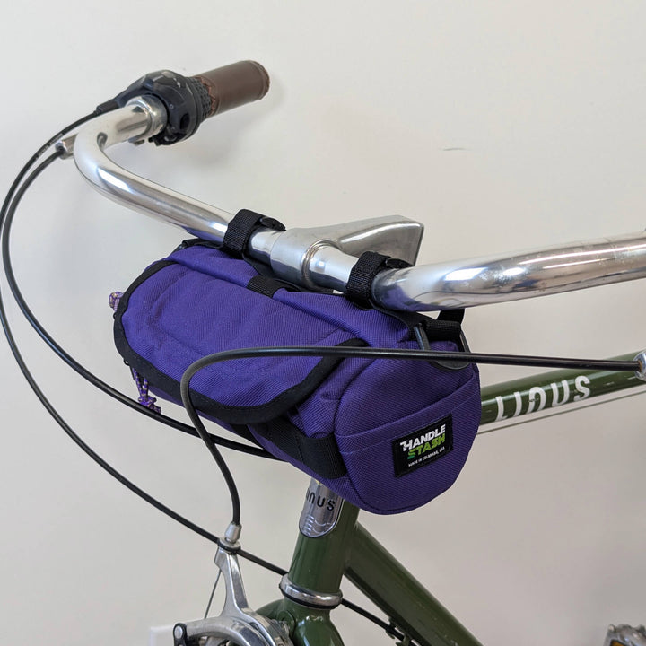 purple handlebar bag on bike