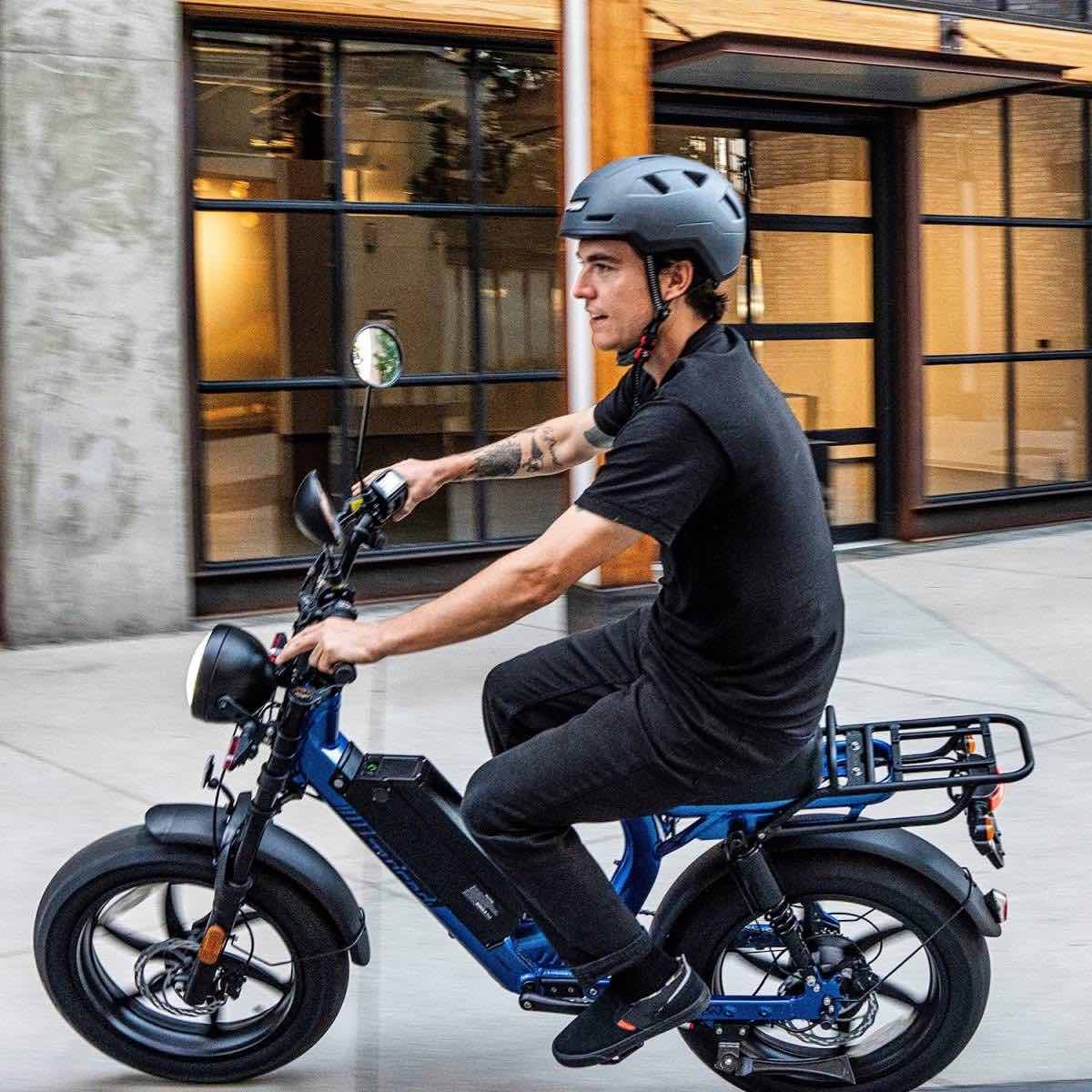 man on class 3 bike with ebike helmet about to tip over