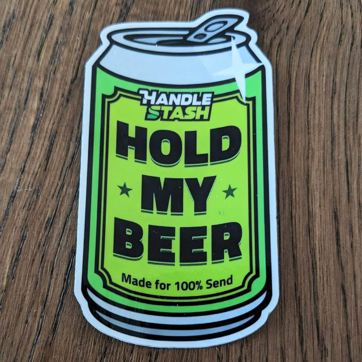 Sticker shaped like beer can with HOLD MY BEER printed in bold.