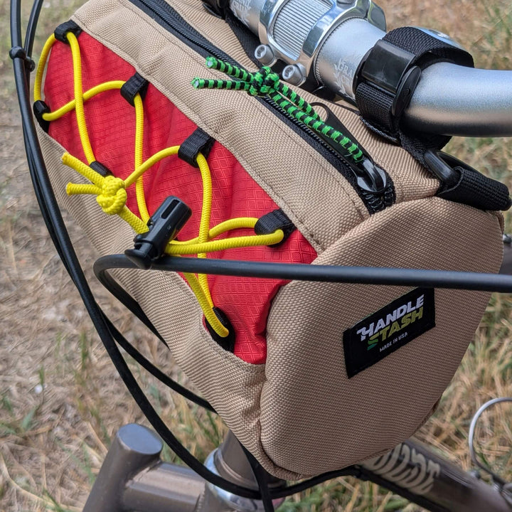 Hot dog themed handlebar bag with grass background
