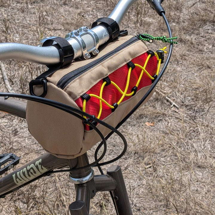 Hot dog themed handlebar bag with grass background
