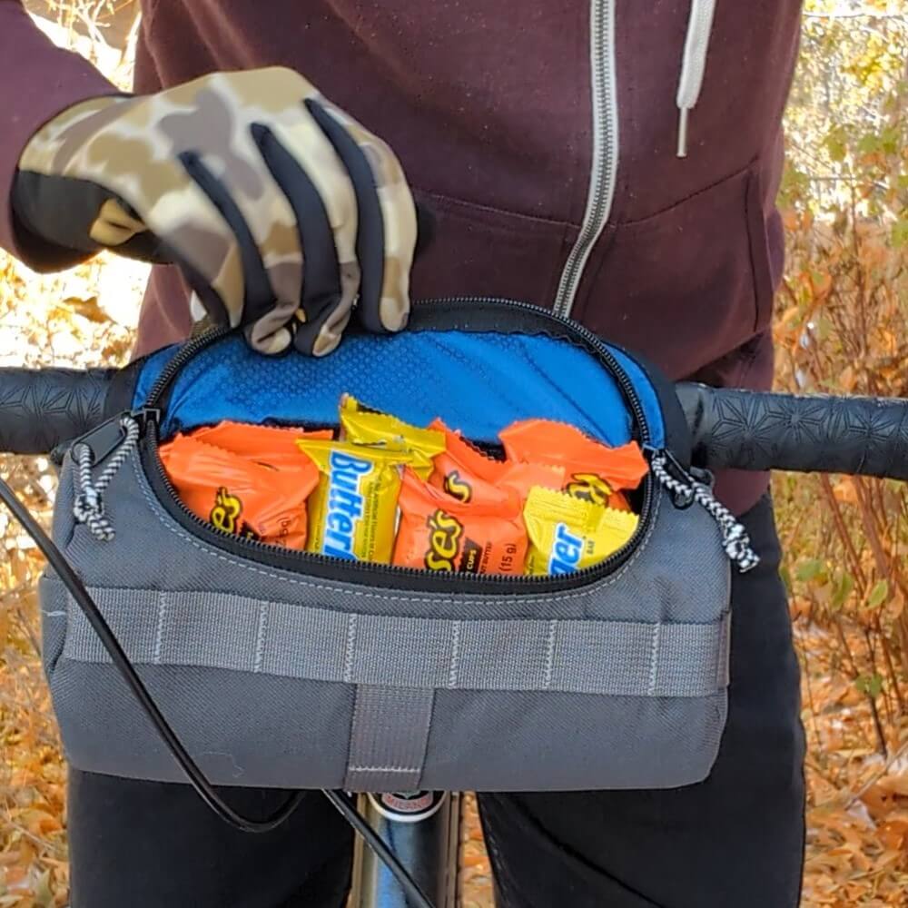 charcoal and blue handlebar bag full of candy