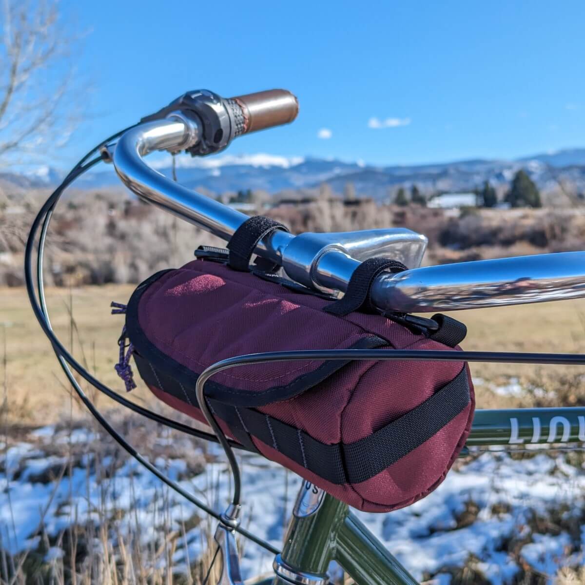wine colored handlebar bag on Dutch bike