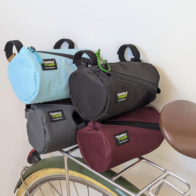 group of mini handlebar bags resting on rear bike rack