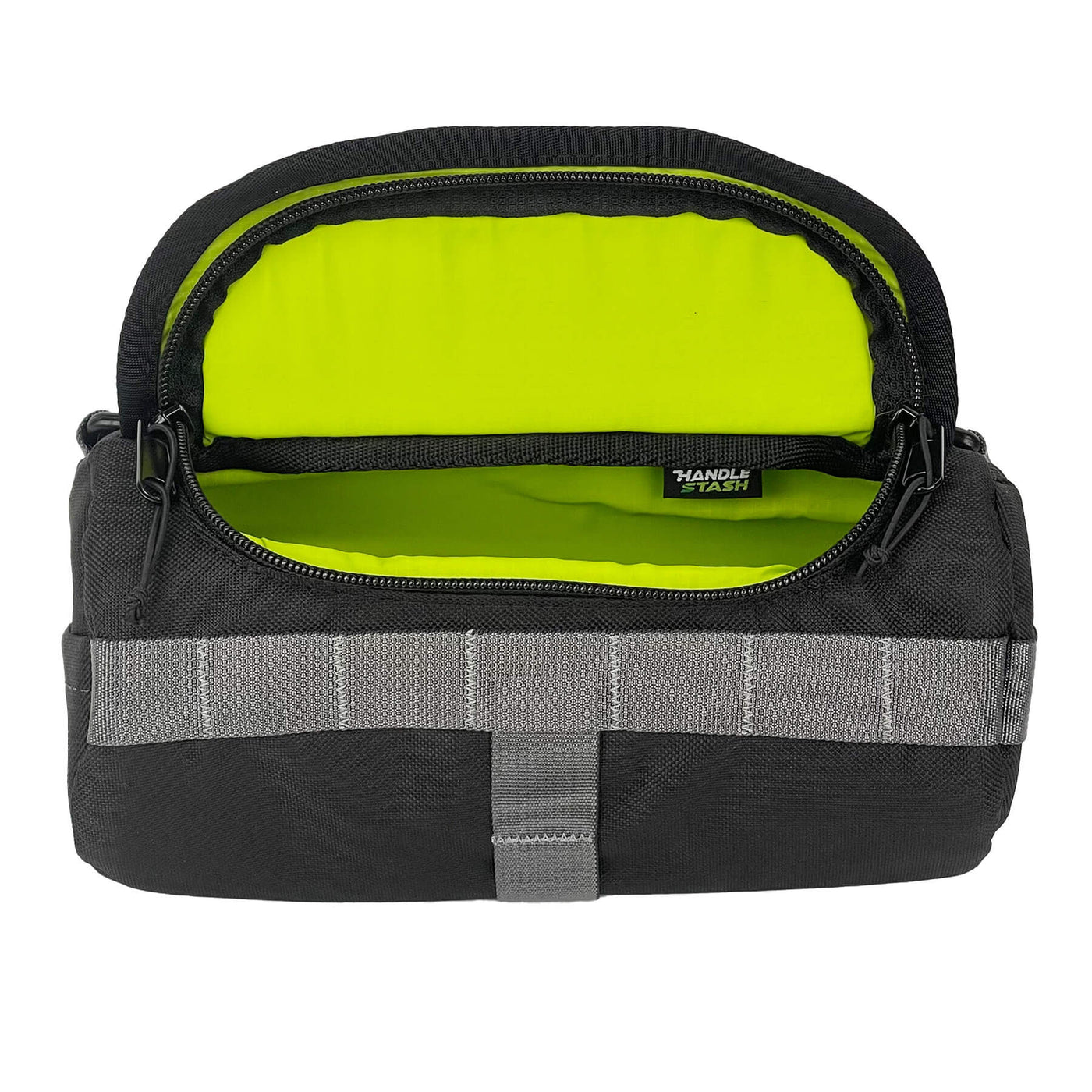 Black HandleStash handlebar bag unzipped with green liner. 