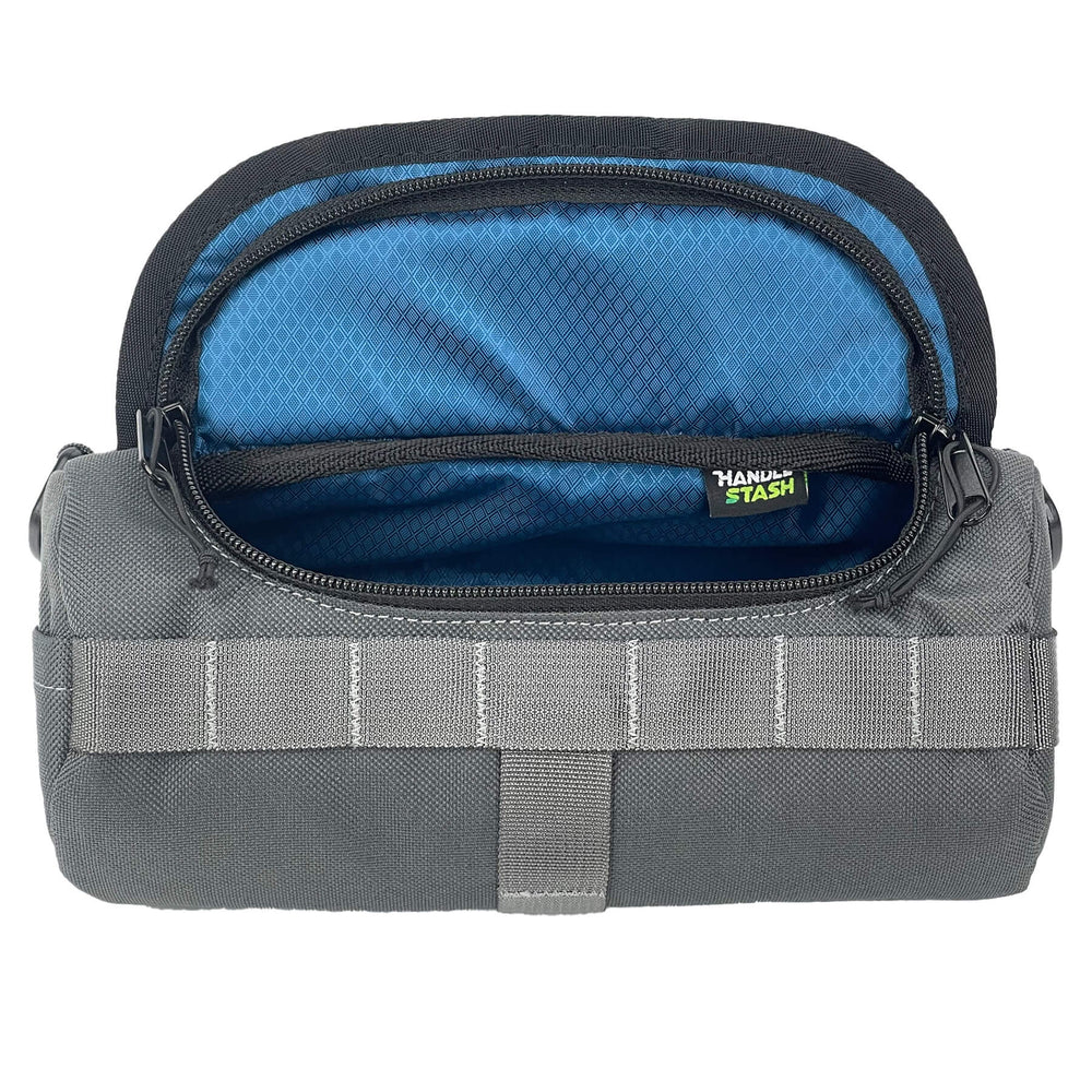 Grey HandleStash bike handlebar bag with navy blue liner. 