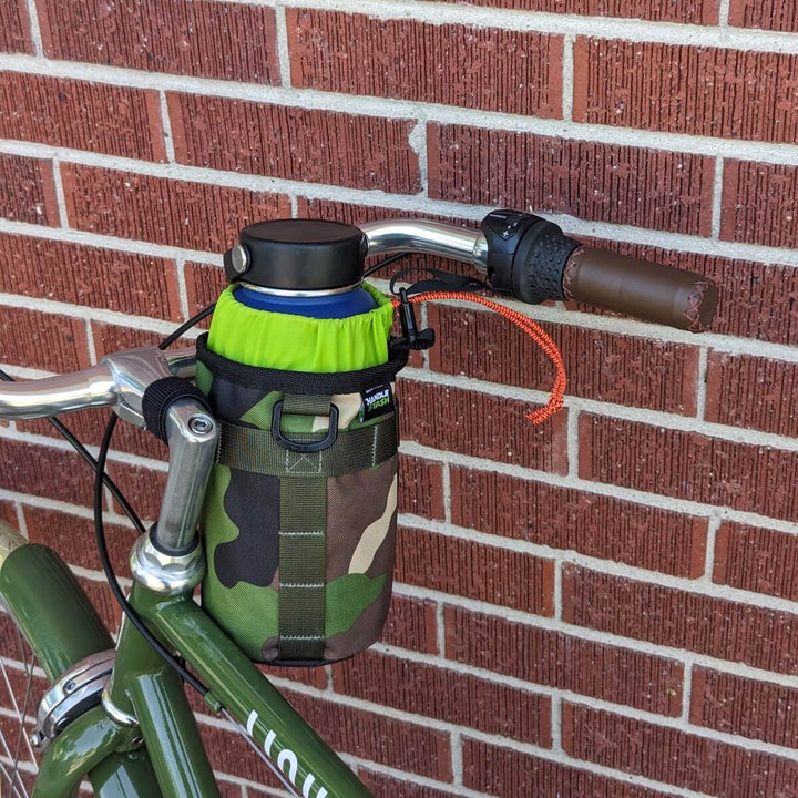 Camouflage bike stem bag with green liner on bicycle handlebars. 