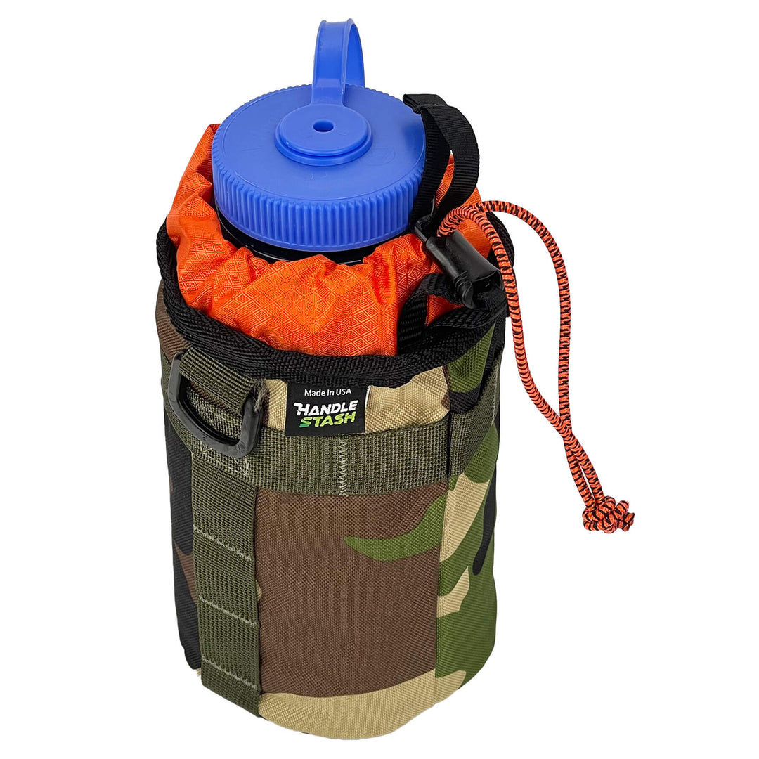 Camouflage bike stem bag with orange liner angle view holding nalgene. 