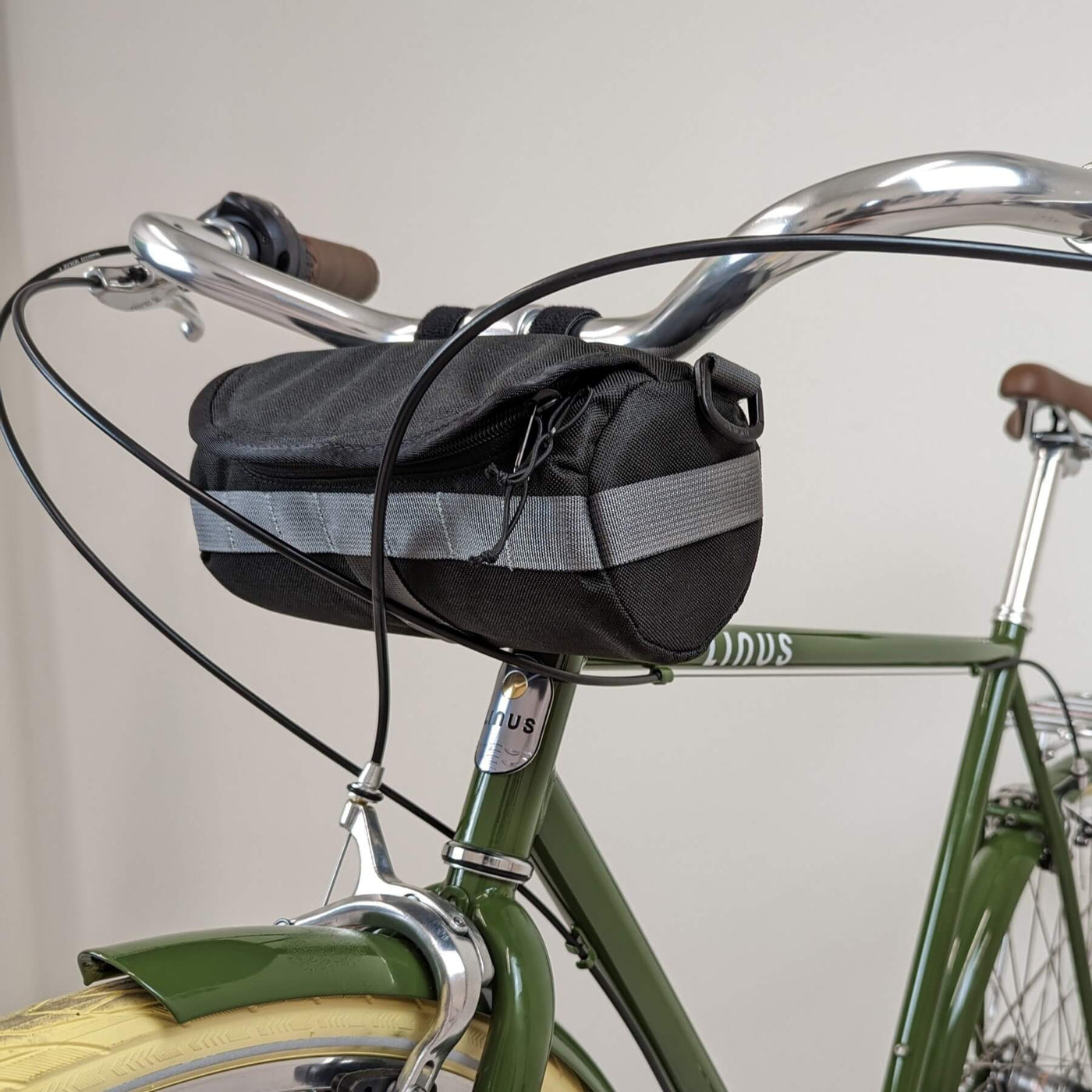 Black handlebar bag on bicycle. 