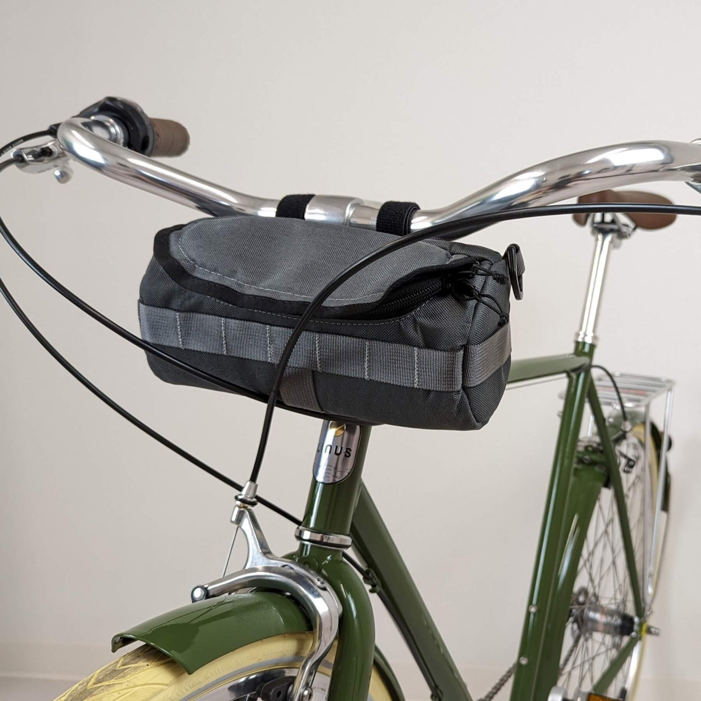 Charcoal HandleStash bike handlebar bag on bike. 