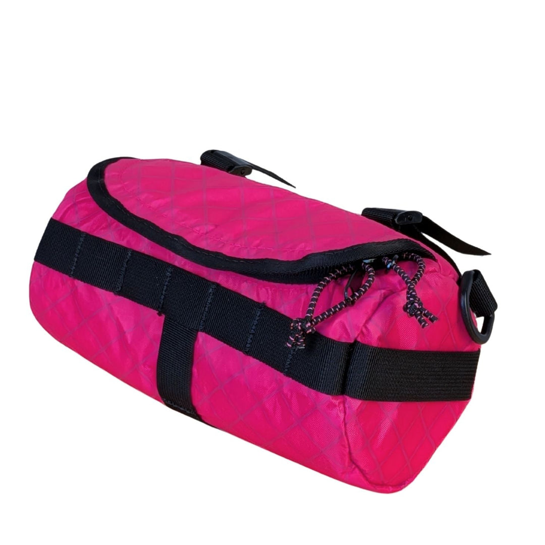 Pink ecopak handlebar bag on white background