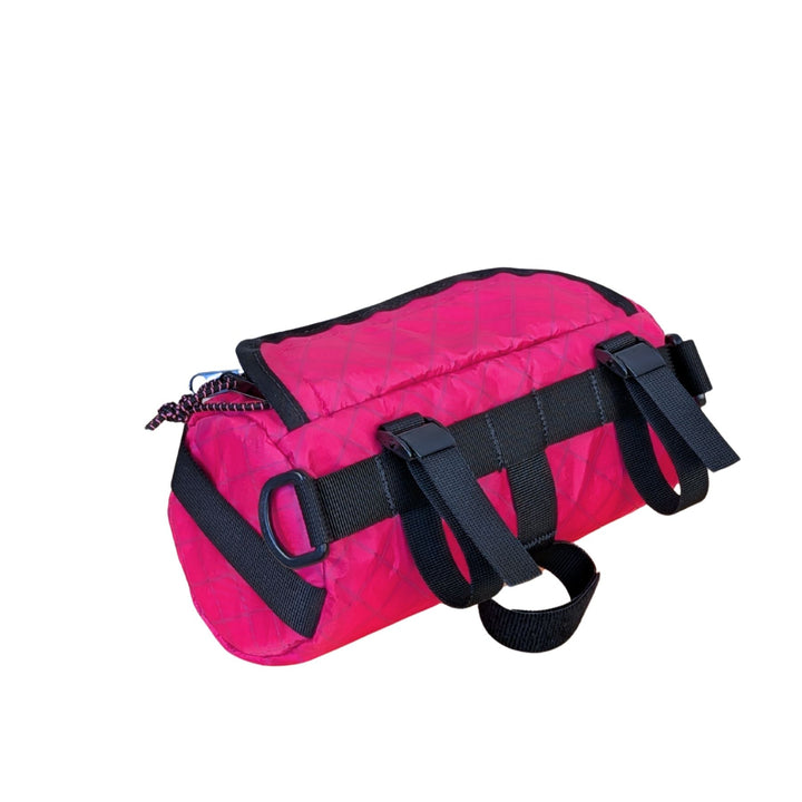 Pink ecopak bar bag with black straps on a white background - side view