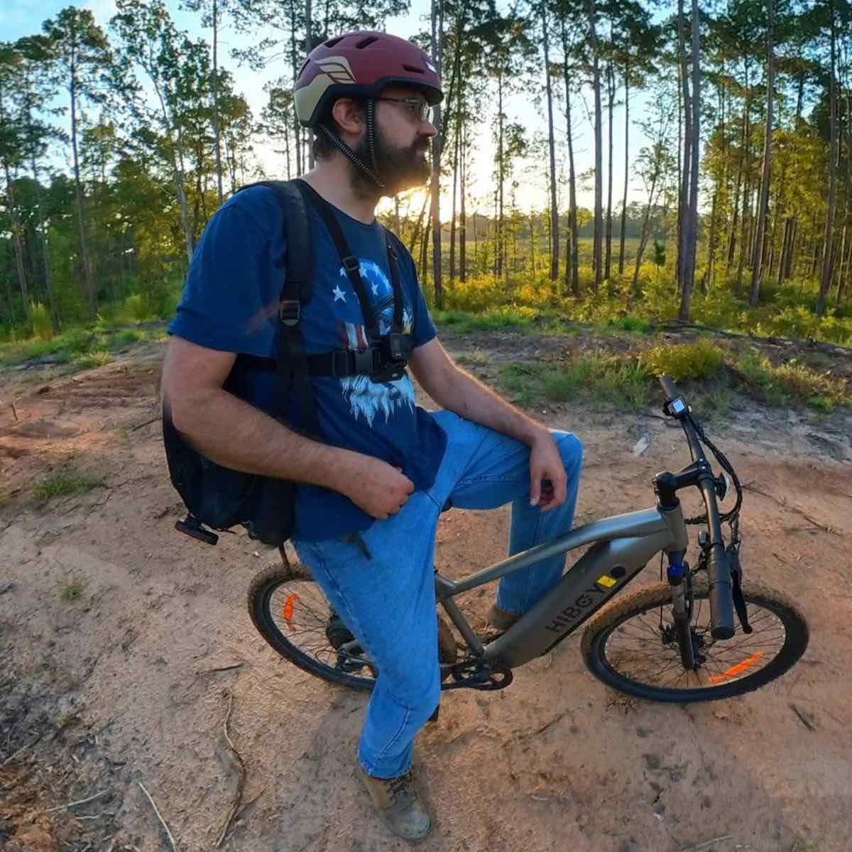 man on class 3 ebike wearing xnito helmet and gopro chest mount but still has reflectors on his bike