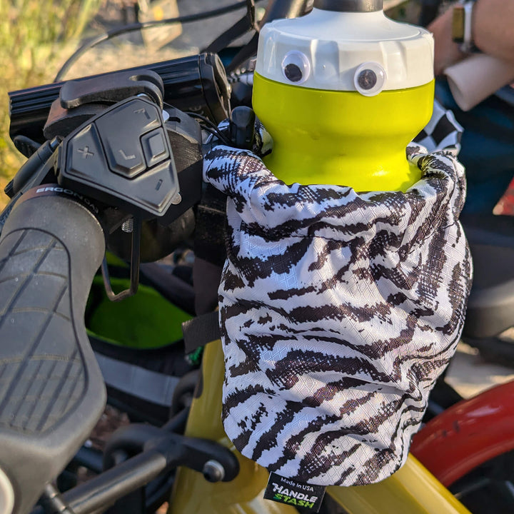 zebra cup holder with a water bottle with googly eyes