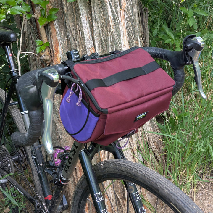 zin stashquatch bar bag on bike against tree