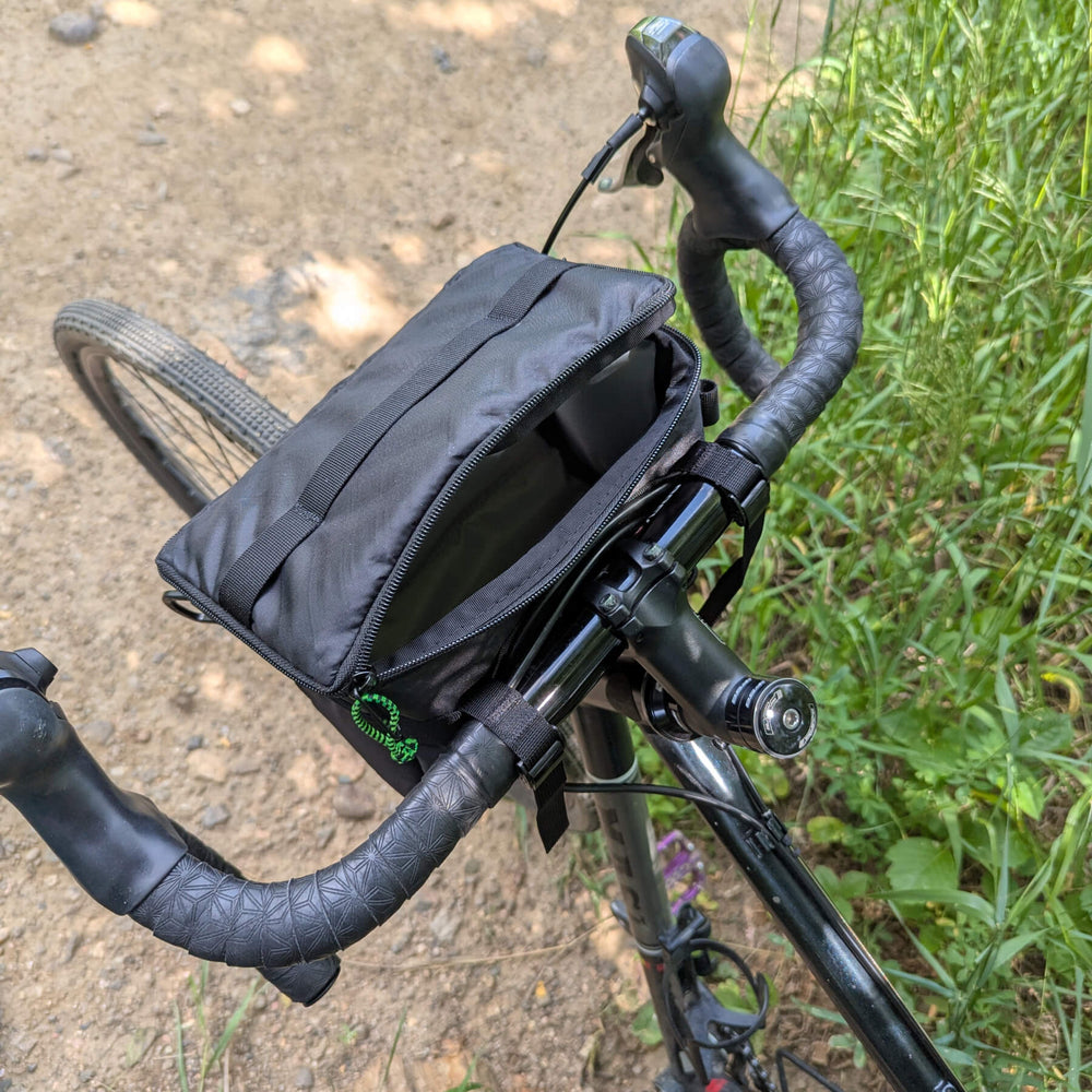 Black ecopak stashquatch bar bag on bike partially open