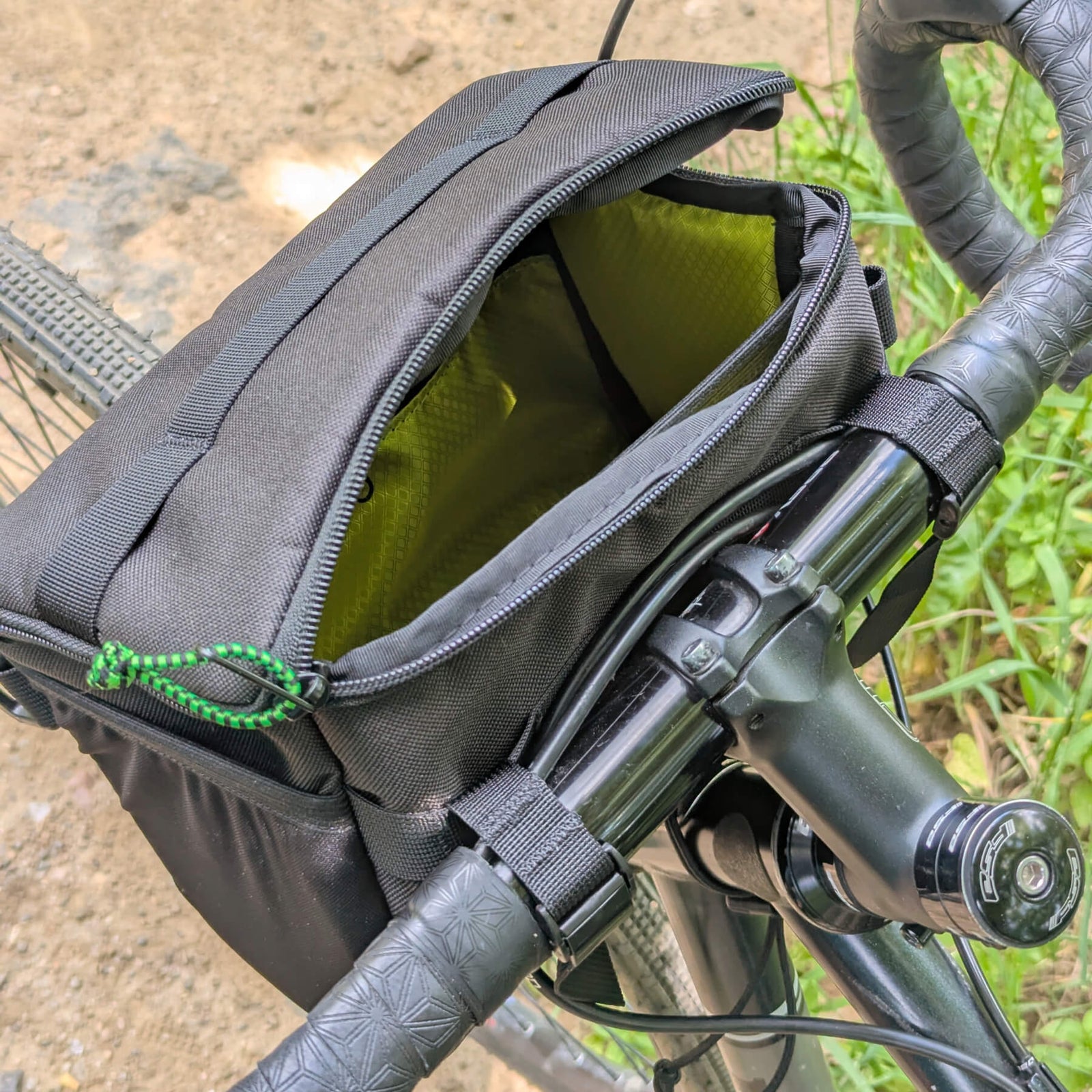 black stashquatch bar bag on bike partially open