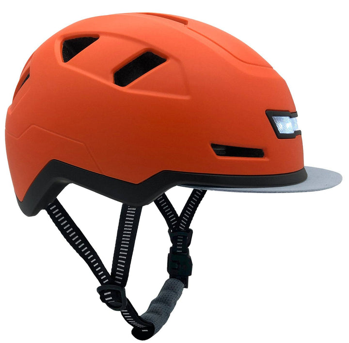 Orange helmet with black straps on a white background