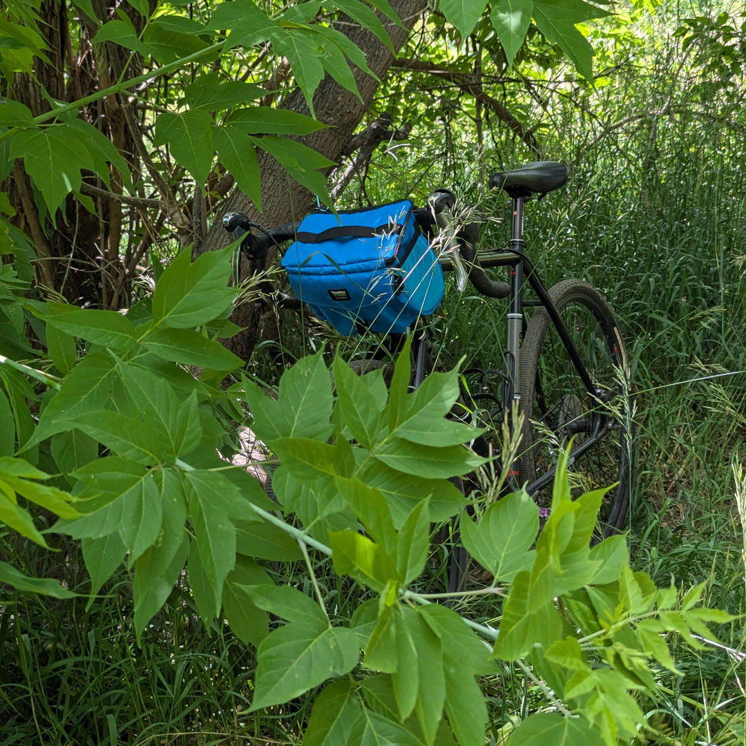 Bluebird stashquatch bag on bike deep in the woods
