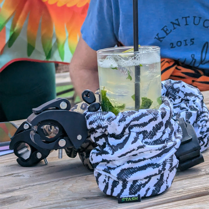 zebra print cup holder with a mojito on a picnic table